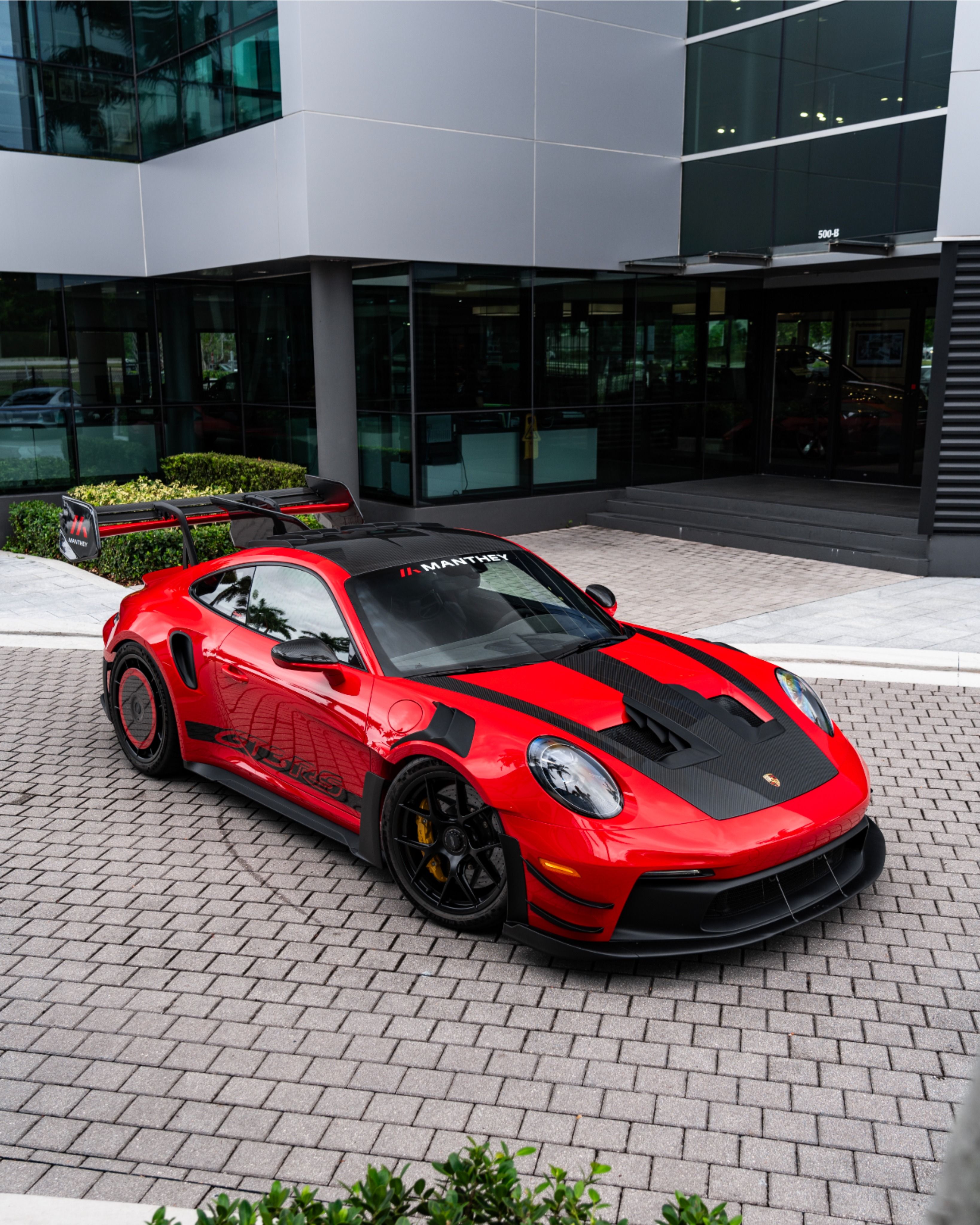 Porsche 992 GT3 RS Manthey’s Guards Red Shines Track Glory!